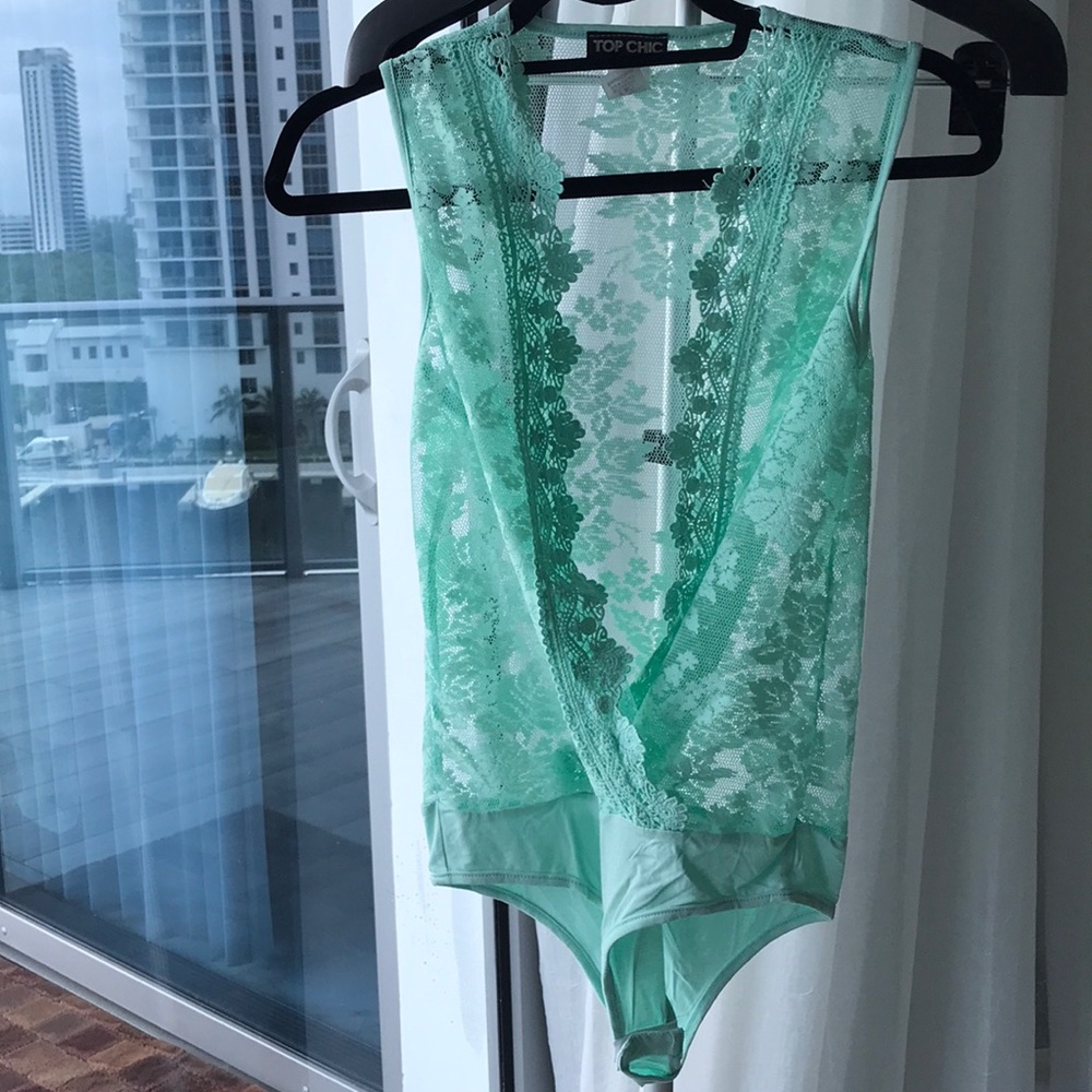 Pastel green body suit